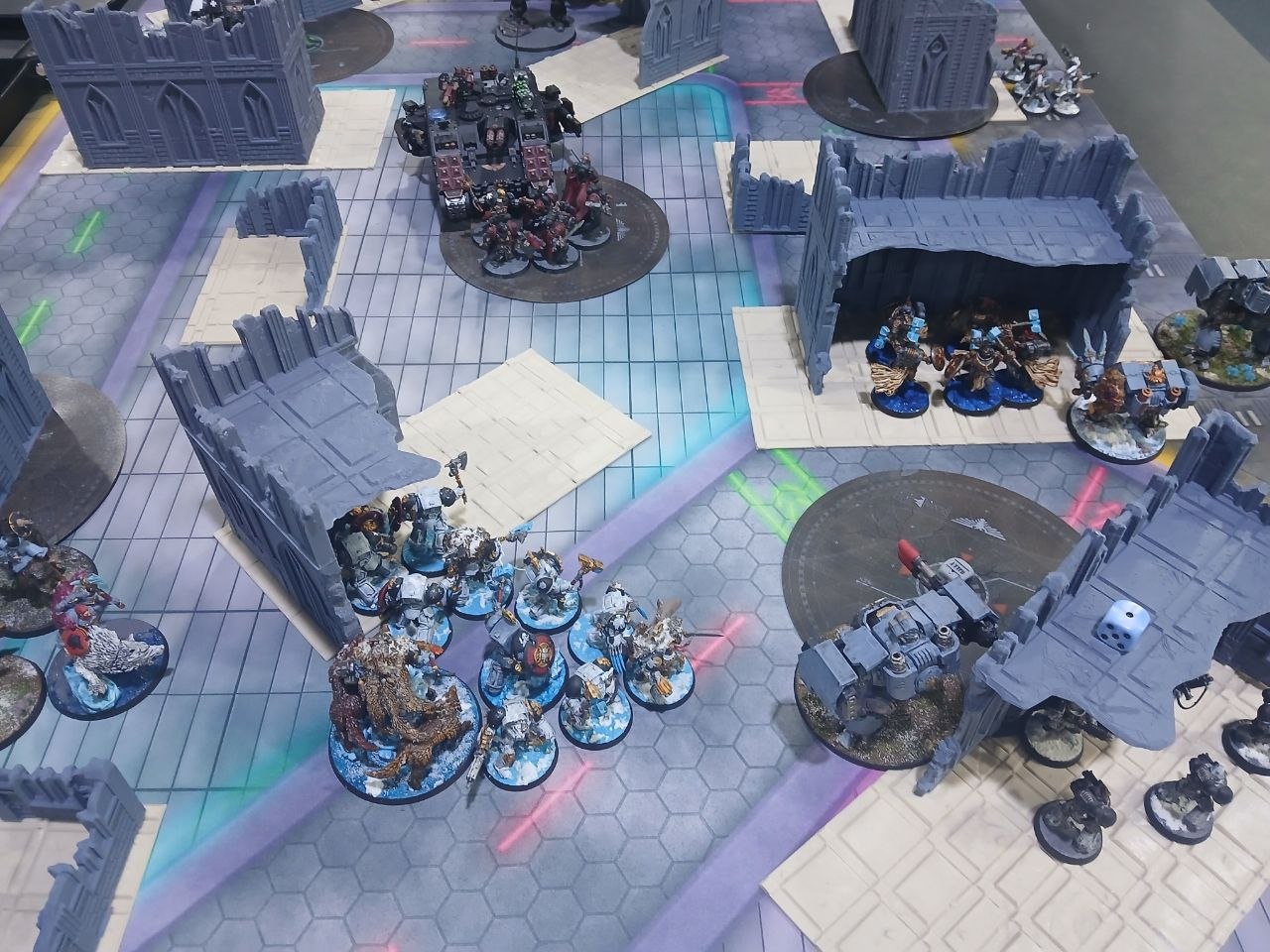 top down picture of table with terrain and warhammer miniatures in play