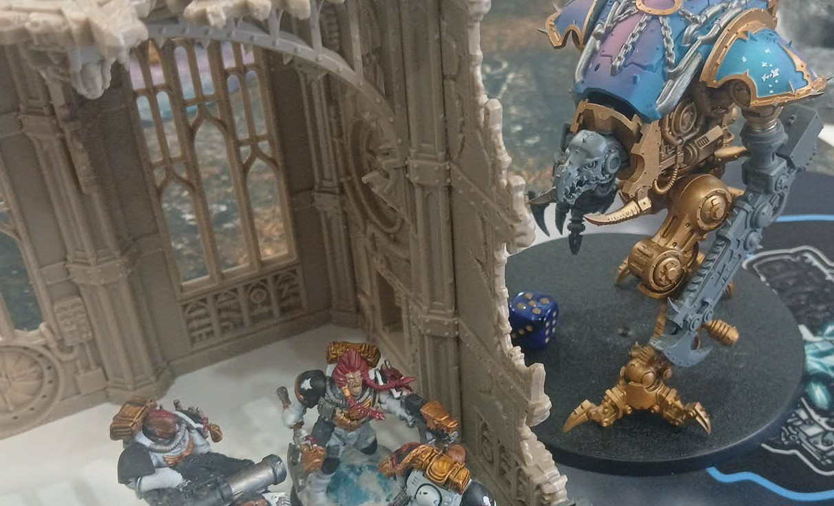 a small chaos knight stalking his space marine prey
